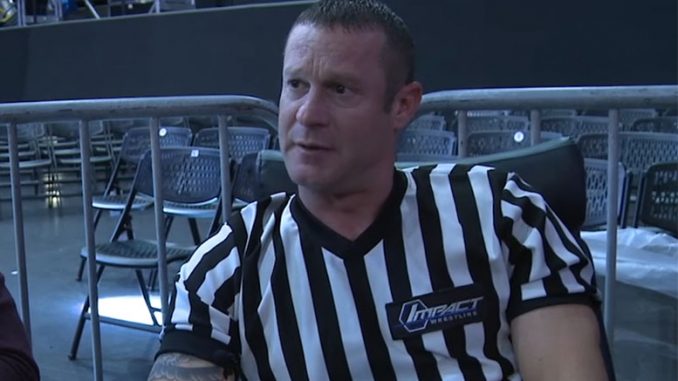 Referee Brian Hebner departs the NWA